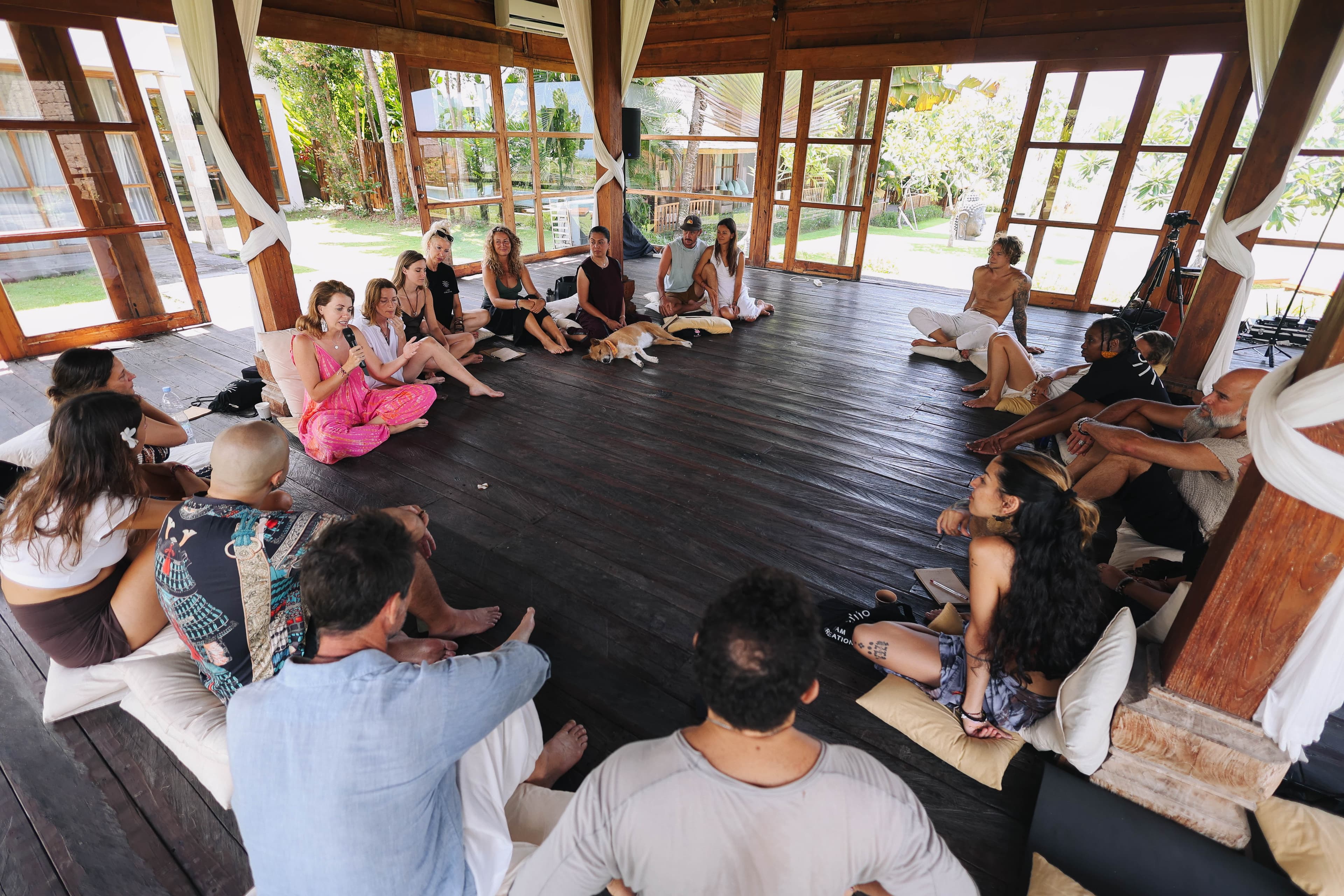 Kirsty in conversation with a small group at a retreat